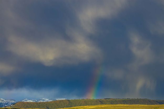 Swirly Clouds And Rainbow Shaft. Photo by Dave Bell.