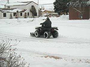 Plowing the town ice skating rink
