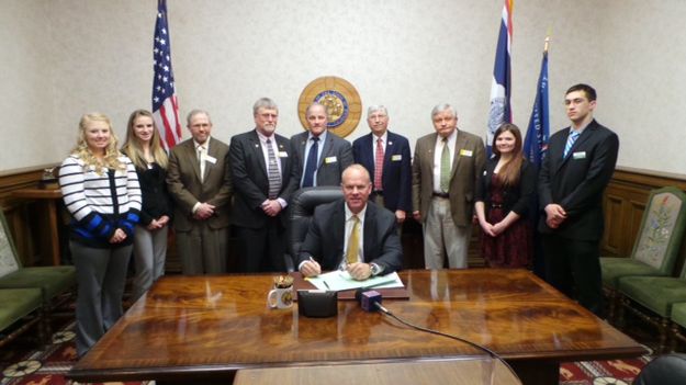 Bill signing. Photo by Governor Mead's office.